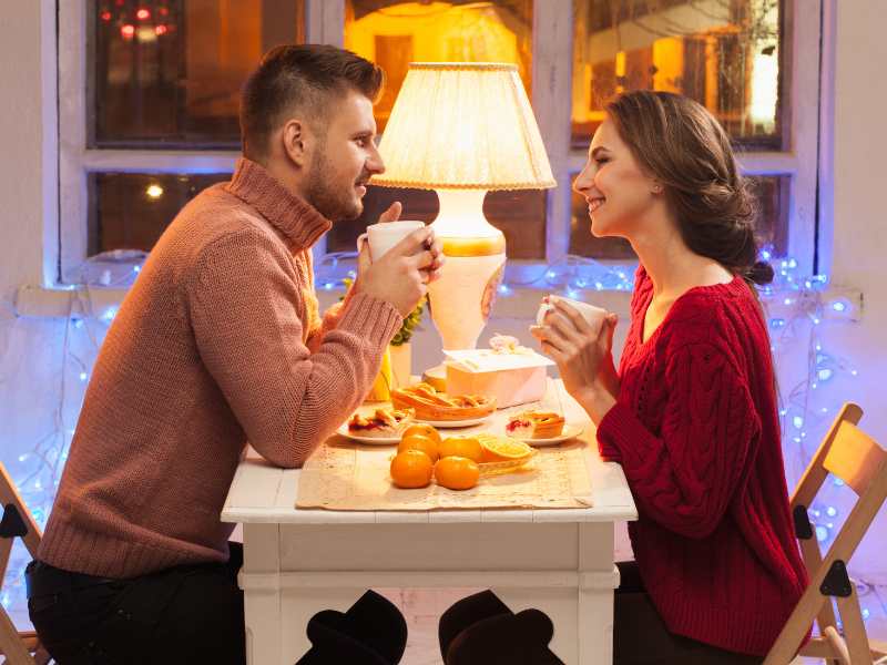 man-and-woman-sitting-opposite-each-other-on-a-date