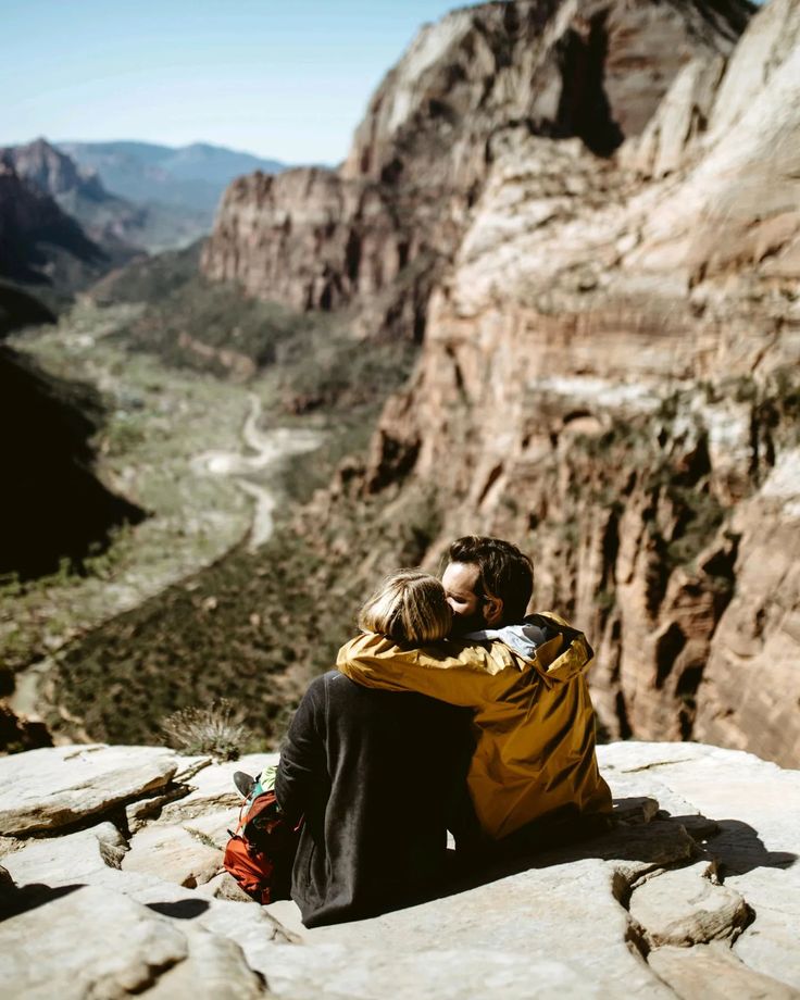 man-and-woman-sitting-on-the-rock