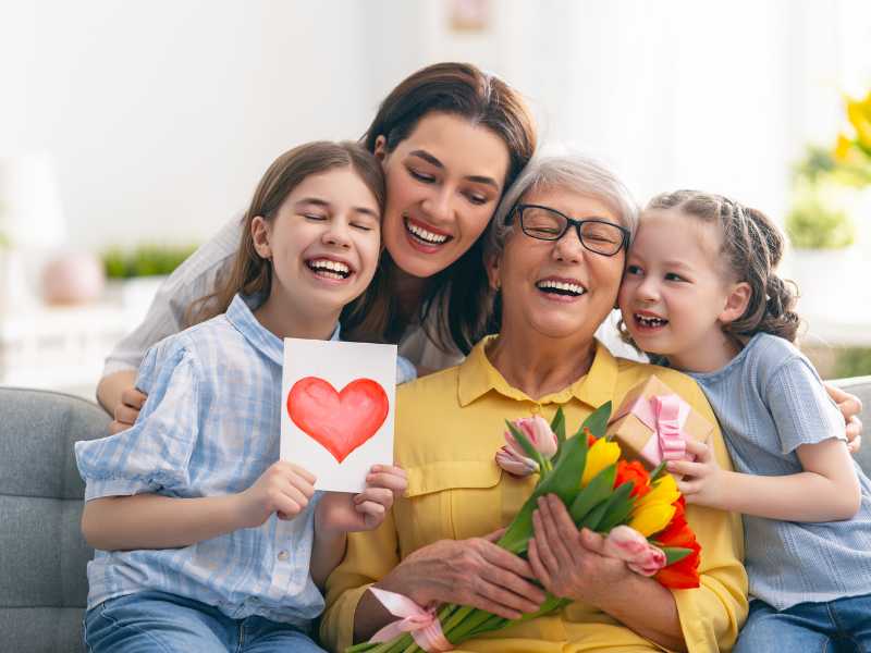 family-of-three-making-their-mom--on-yellow-top-feel-special-on-valentine's-day