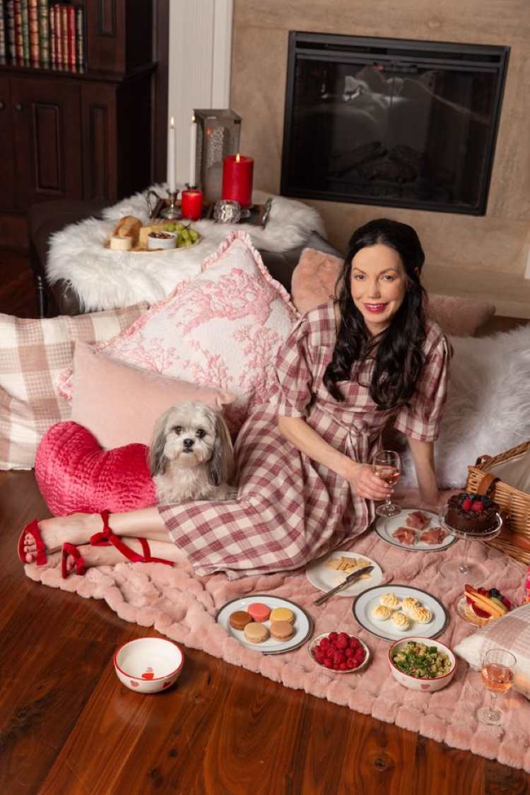 a-lady-sitting-on-the-floor-with-varieties-of-food