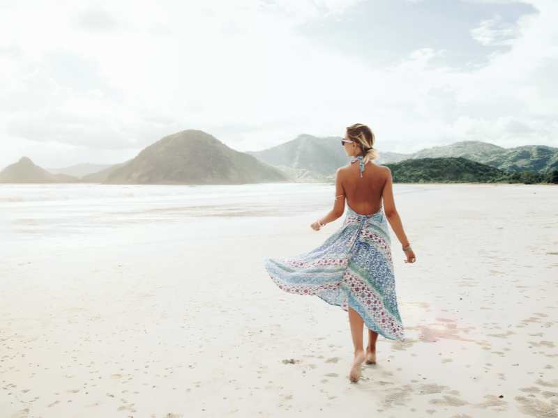 lady-walking-by-the-sea-shore