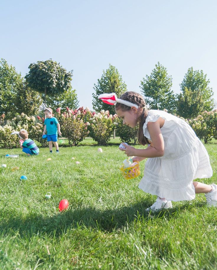 little-girl-picking-easter-egg-in-the-field