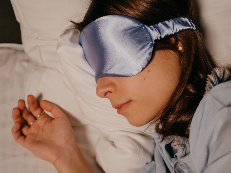 woman-lying-with-a-ash-color-eye-mask