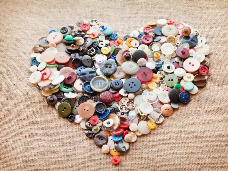 a-button-art-shaped-on-a-brown-background