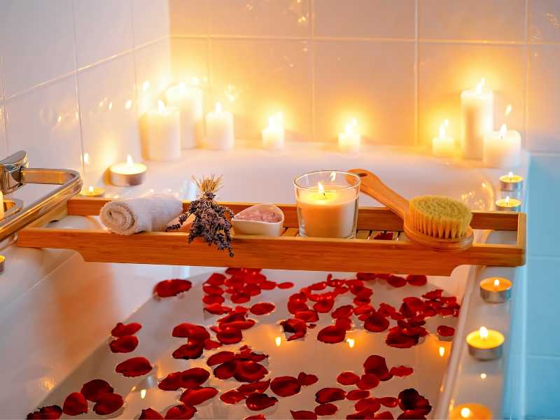 rose-petal-in-a-bath-tub-with-candle-light-round-it