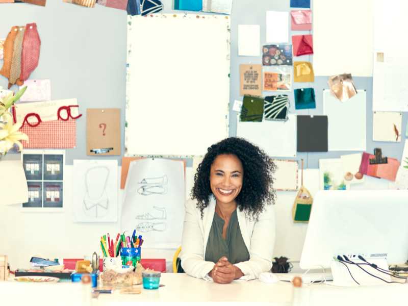 a-teacher-smiling-why-in-her-office