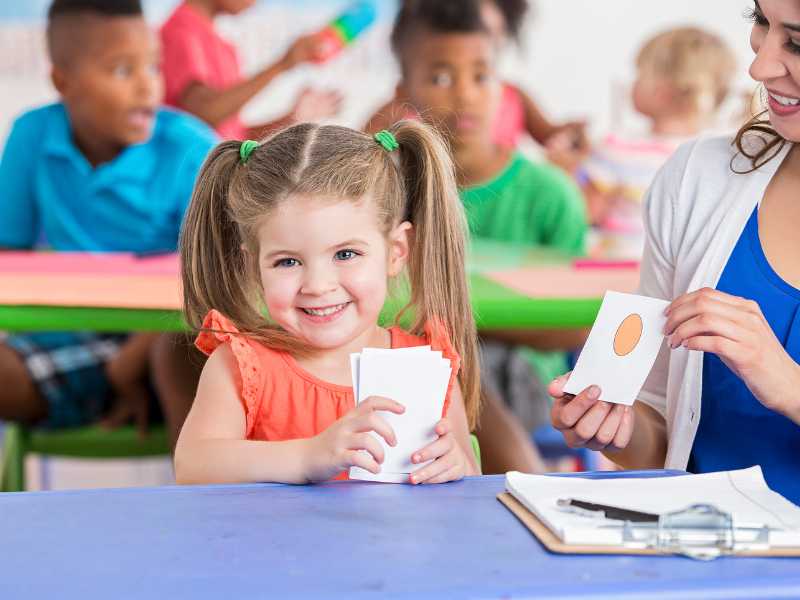 kid-study-in-class-with-teacher-on-a-easter-basket