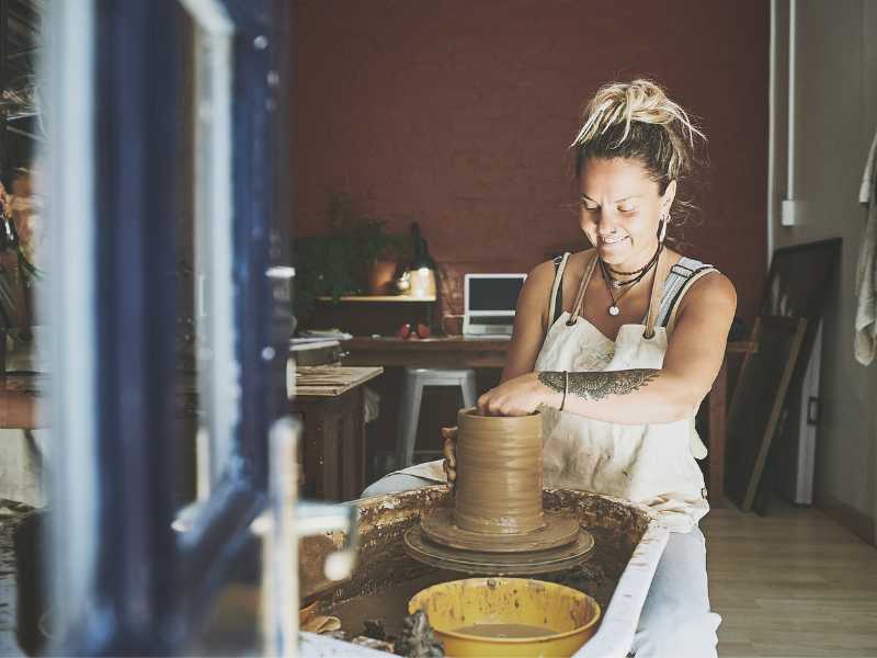 a-lady-working-on-a-clay-pot