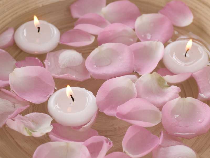 pink-and-white-candle-in-water