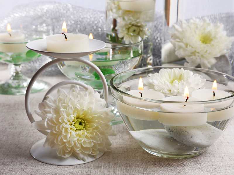 a-floating-flowers-in-a-glass-bowl-with-candles