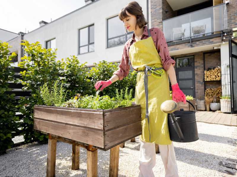 mother-taking-care-of-her-flower-garden