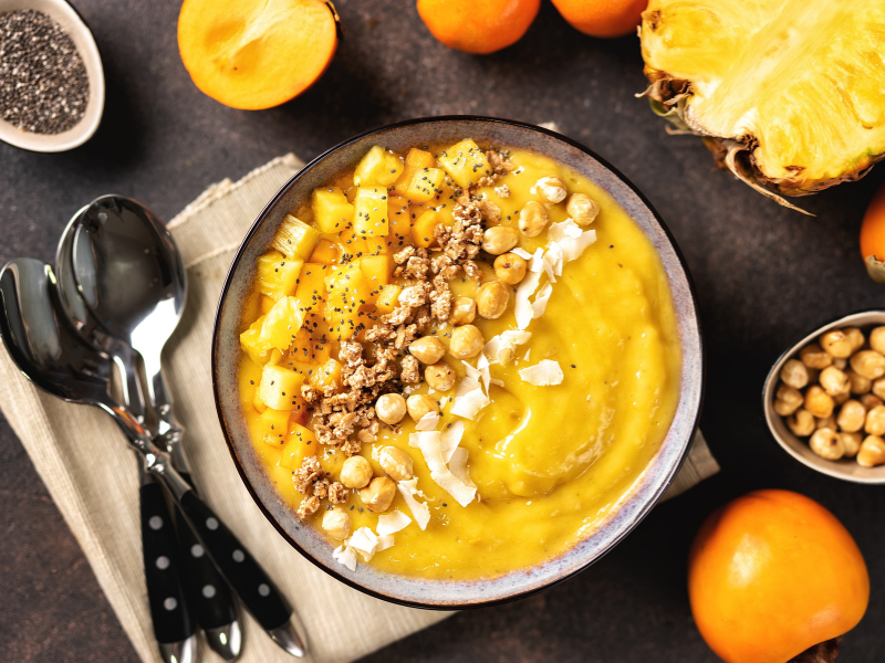 coconut-and-mango-smoothie-in-a-white-round-bowl