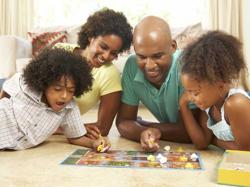 family-of-four-playing-game-on-mothers-day