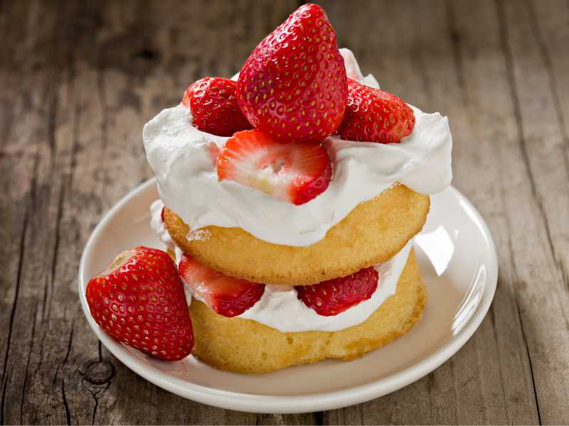 strawberry-shortcake-garnish-with-whipped-cream-on-a-white-side-dish-for-mothers-day-dinner