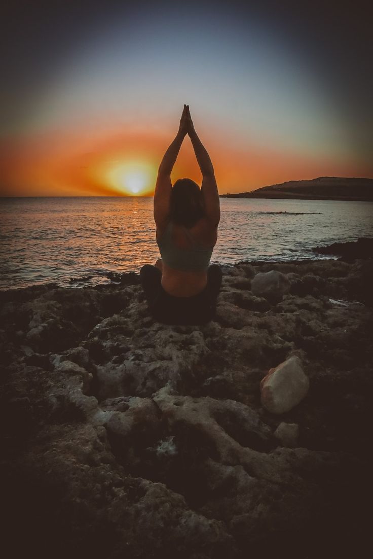 woman-in-a-yoga-position-at-sunrise