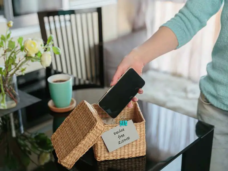 woman-putting-her-phone-in-a-box