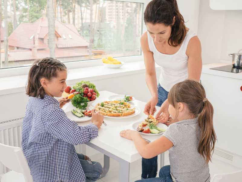 mother-and-children-planning-a-special-meal-for-mothers-day-tip