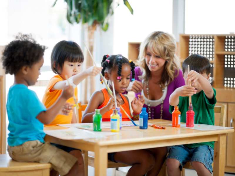 kids-painting-on-a-brown-table-an-ideal-easter-activities-for-preschoolers