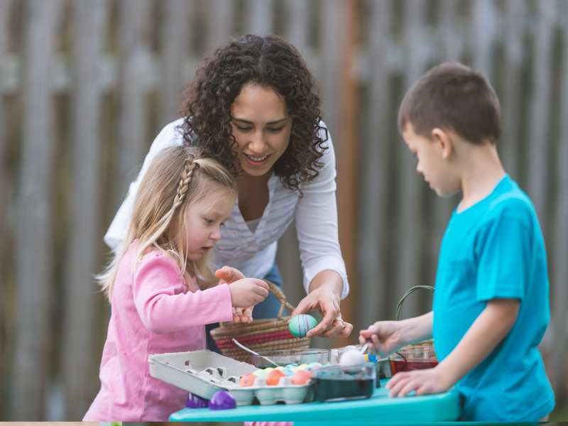 woman-with-kids-sorting-easter-eggs-perfect-for-easter-morning-routines-with-kids