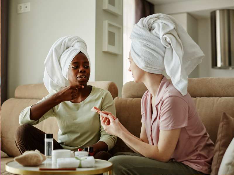 women-with-with-white-towels-tied-on-their-head-perfect-for-self-care-tips-for-moms-on-mother's-day