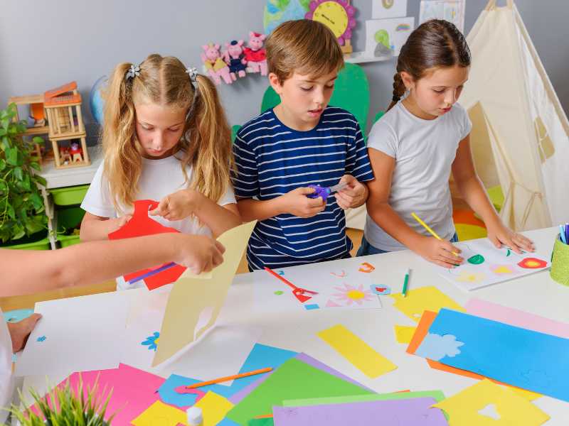 three-kids-doing-art-and-craft-work