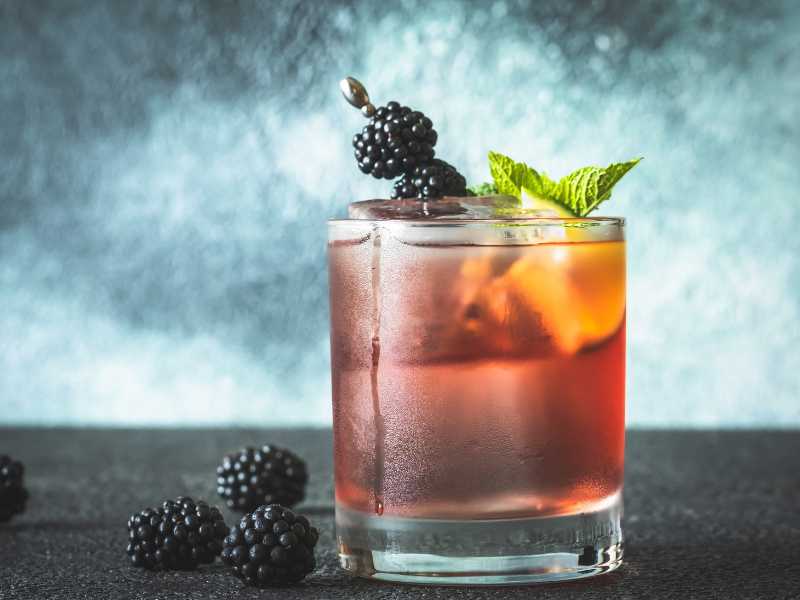 blueberry-bourbon-smash-with-berries-and-lemon