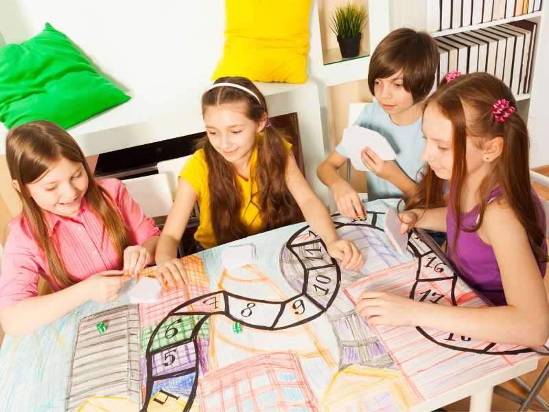 kids-playing-board-game-and-card-game-in-spring-family-bucket-ideas