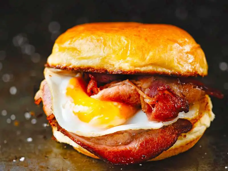 a-single-sandwich-breakfast-in-bed