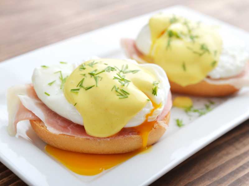 two-egg-benedict-in-a-white-serving-plate