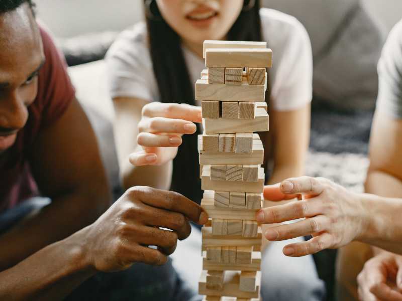 guys-and-ladies-playing-a-jenga-in-outdoor-spring-parties