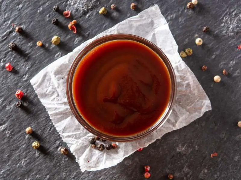 a-bbq-sauce-on-a-black-background