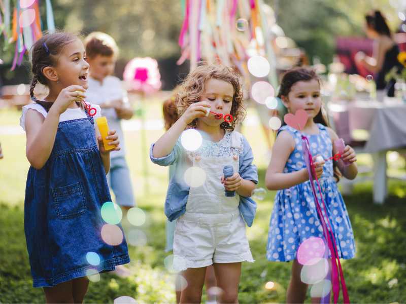 kids having-fun-with-bubbles-in-spring-photograph