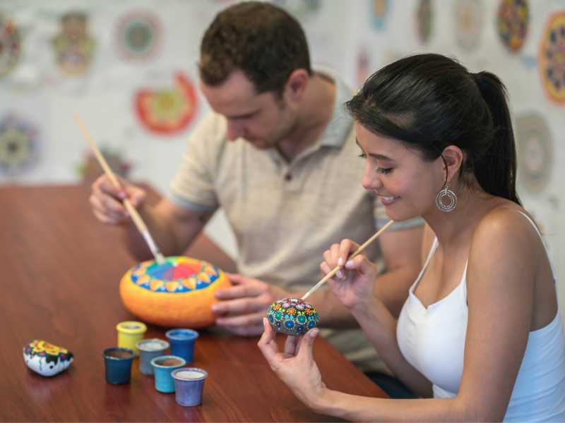 couple-painting-rock-with-multi-color