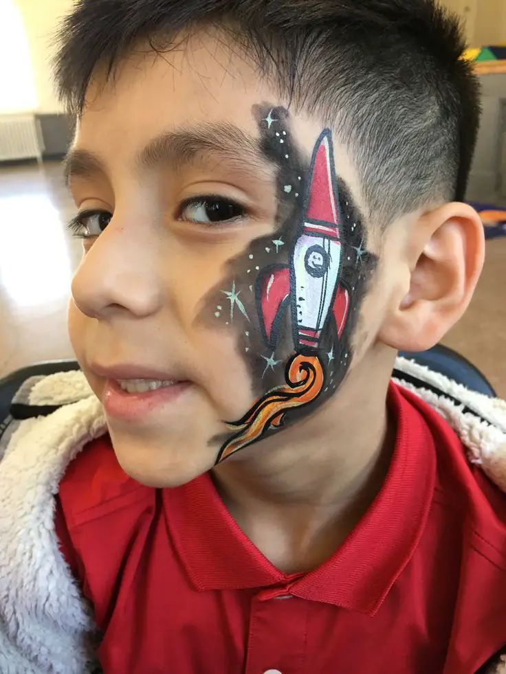 a-boy-eith-rocket-pop-in-the-face-4th-of-july-face-painting-ideas