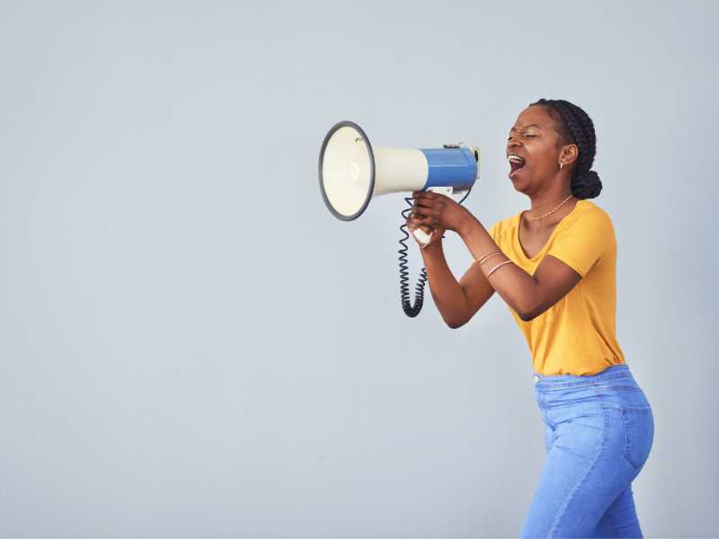 a-woman-with-a-megaphone-directing-spring-edition