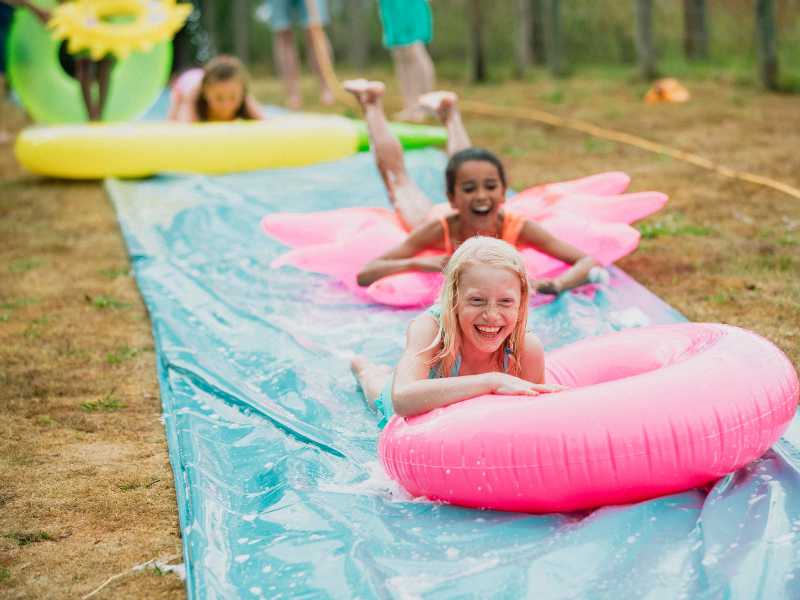 children-playing-slip-and-slide-game