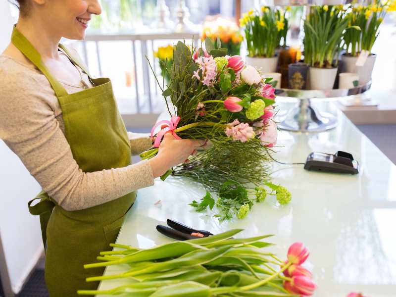 lady-arranging-spring-flowers