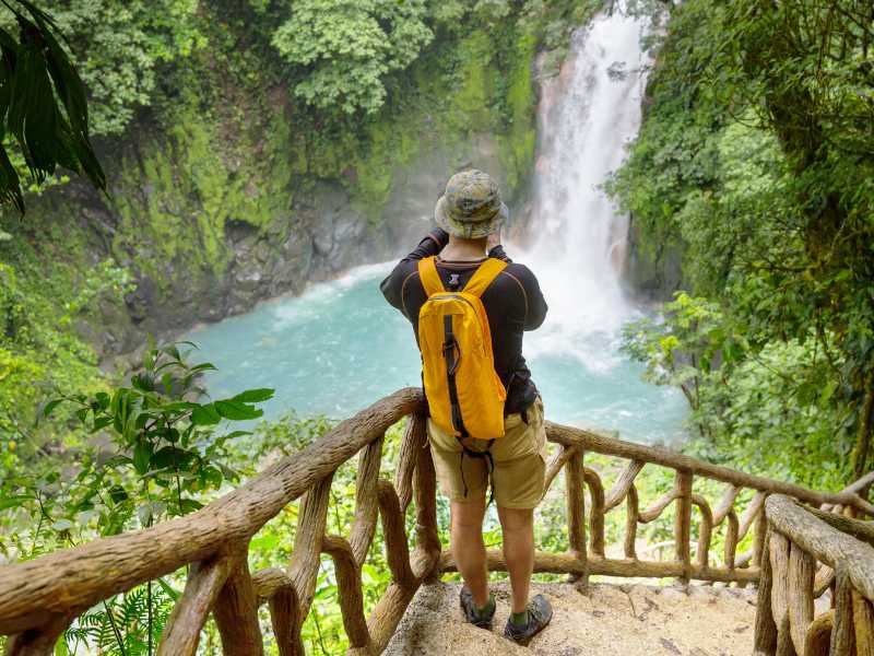 a-man-looking-at-waterfall