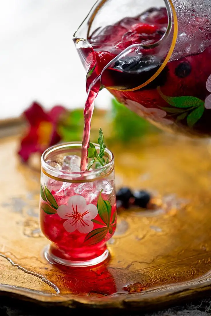 a-jar-of-infused-tea-pouring-in-a-cup
