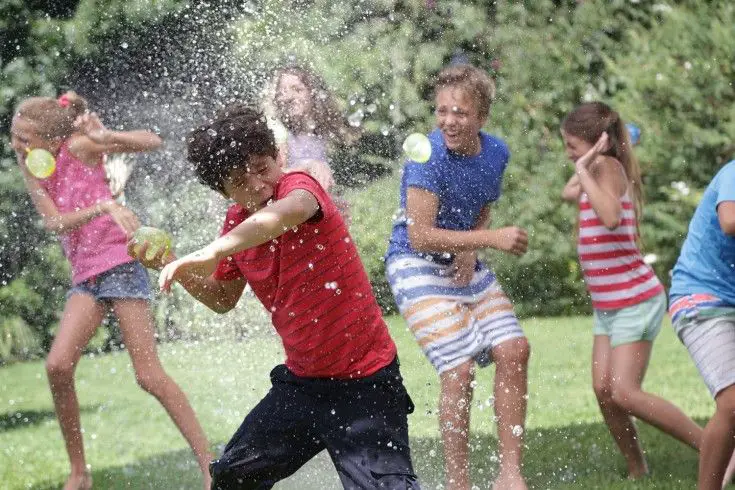 children-having-fun-with-water-balloon-fight
