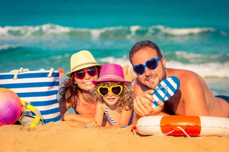 family-of-three-out-in-the-beach