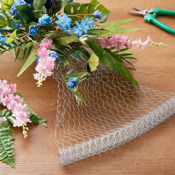 a-bunch-of-flower-arrange-in-a-chicken-wire-for-stnning-spring-flowers