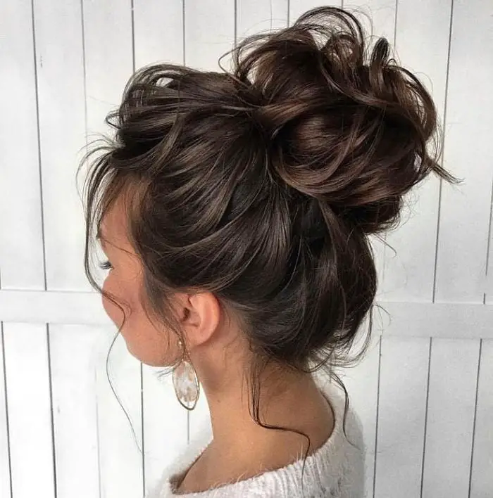 Lady-with-a-high-messy-bun-hairstyle