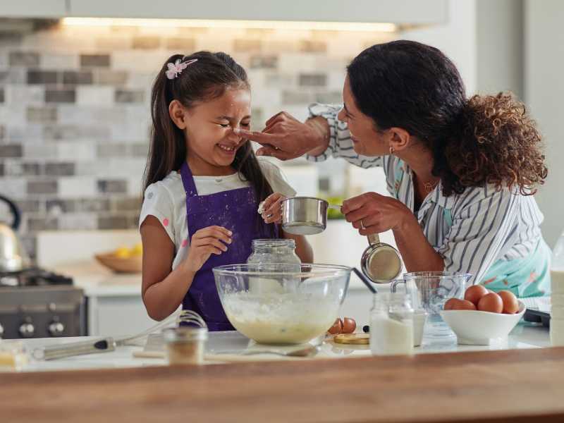 mom-making-food-fun-with-daughter
