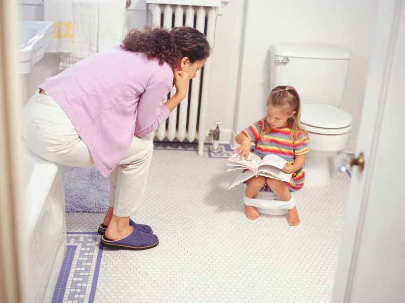 reading-potty-themed-book-with-toddler-to-potty-train-your-toddler-fast