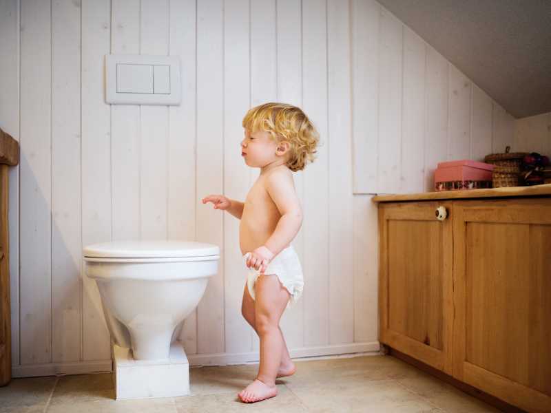 toddler-showing-interest-in-the-toilet-to-potty-train-your-toddler-fast