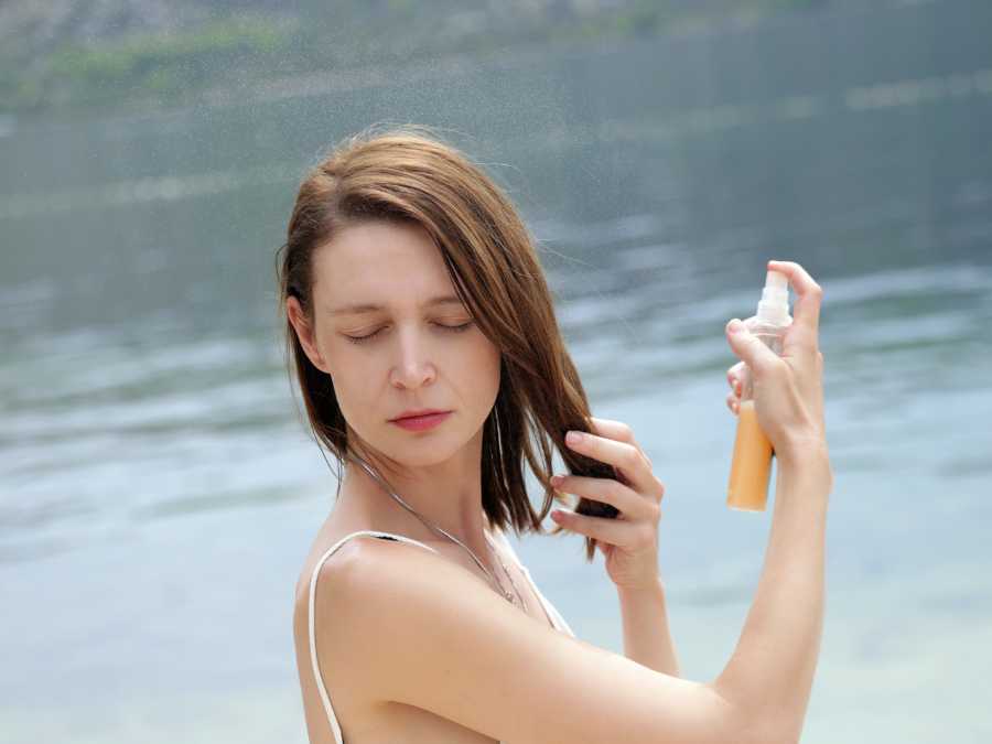 mom-applying-a-bit-of-water-to-hair