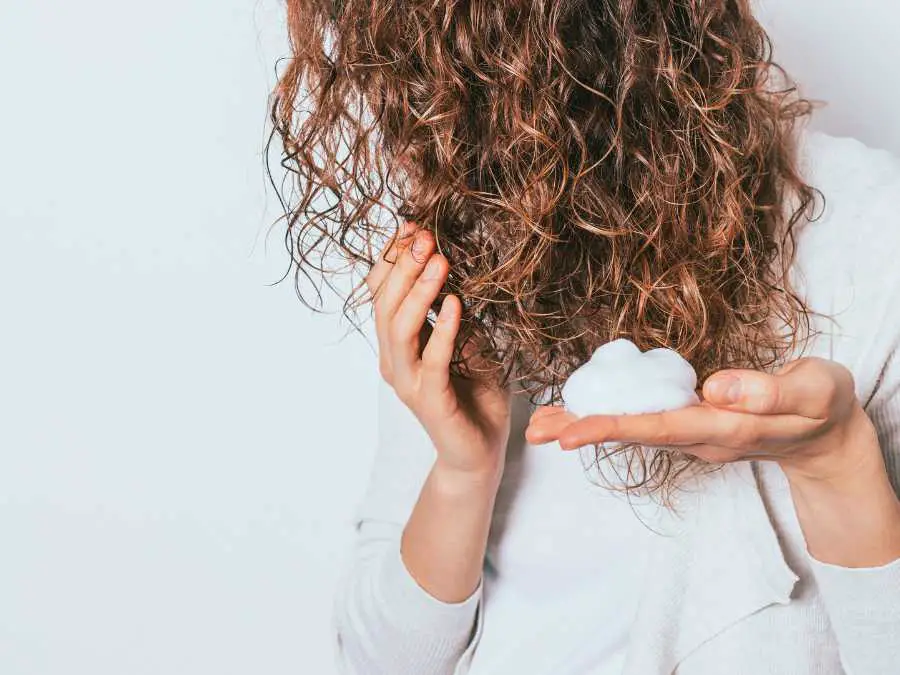 applying-mousse-in-hair-stunning-wedding-hairstyle-for-