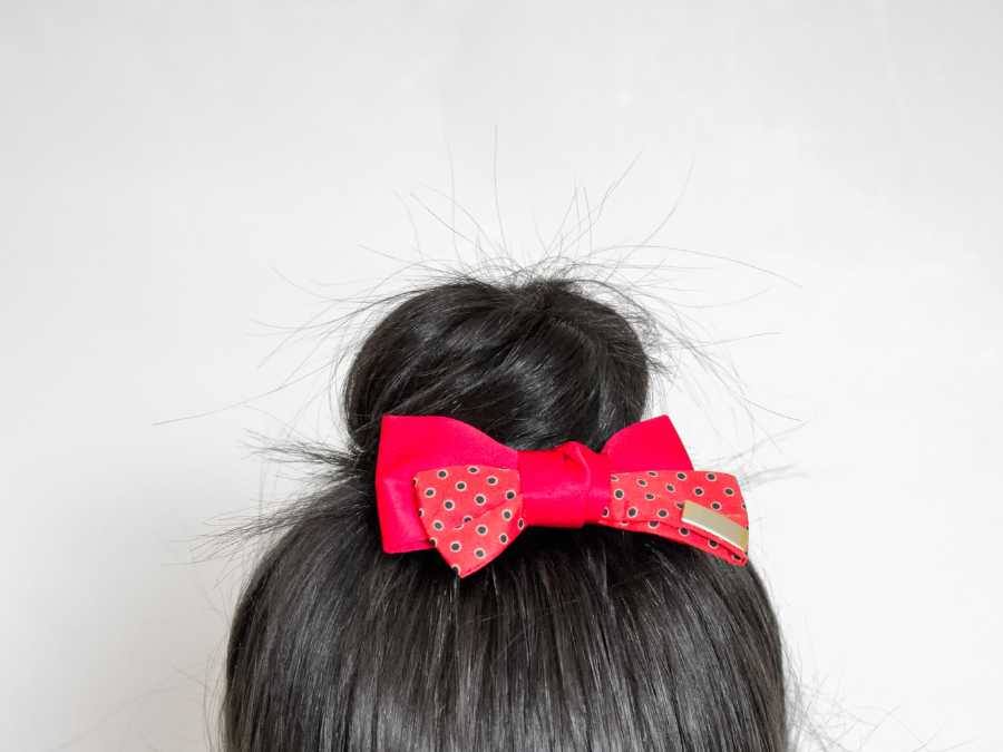 low-bun-with-red-bow-achieve-adorable-baby-hairestyle-with-bow
