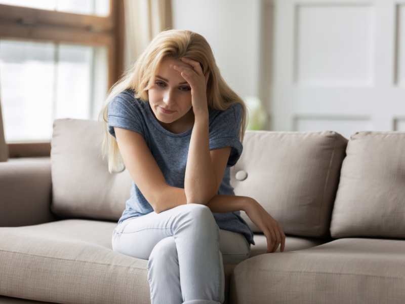 woman-sitting-on-couch